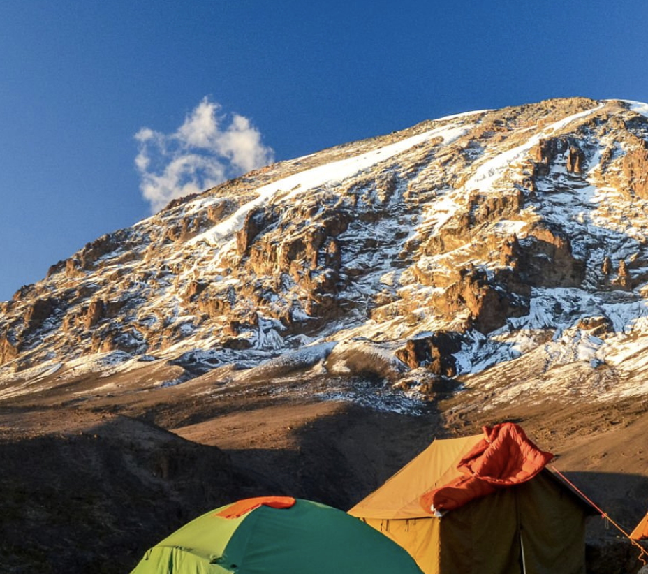 Colorful tents at Kilimanjaro base camp on Marangu route